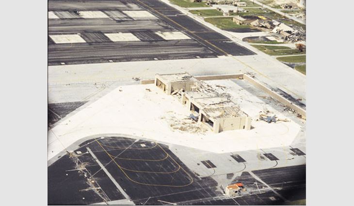 A substantial amount of roof deck material blew off these hangars. At one hangar, many trusses also were blown away. Two nearby fighter aircraft appeared to be damaged, as well.