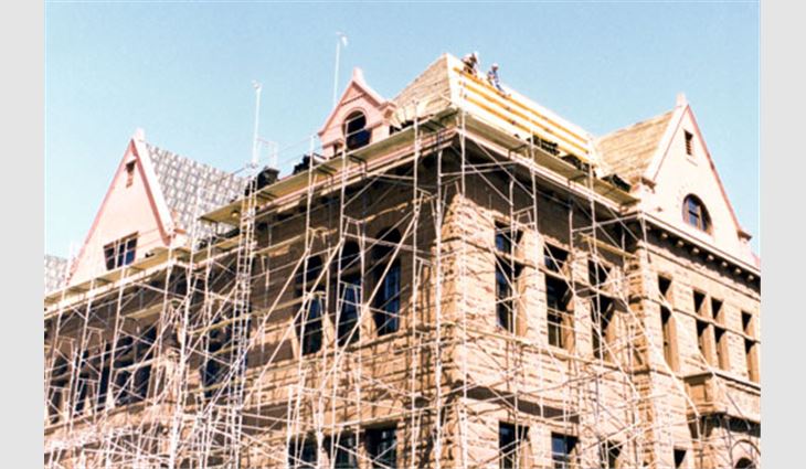 Scaffolding was erected around the building but could not touch the building's sandstone.