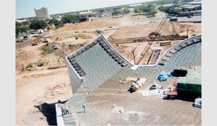 Exploration Place's roof systems consist of a cement-gray custom-manufactured Sarnafil S327 membrane.