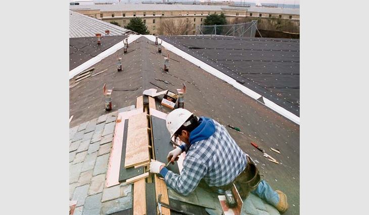 Workers try to restore the roof system by Sept. 11.