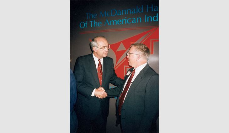 J. Dudley Miles III (right), president of J.D. Miles & Sons Inc., Chesapeake, Va., talking with Sen. Phil Gramm (R-Texas) at the 1992 convention.