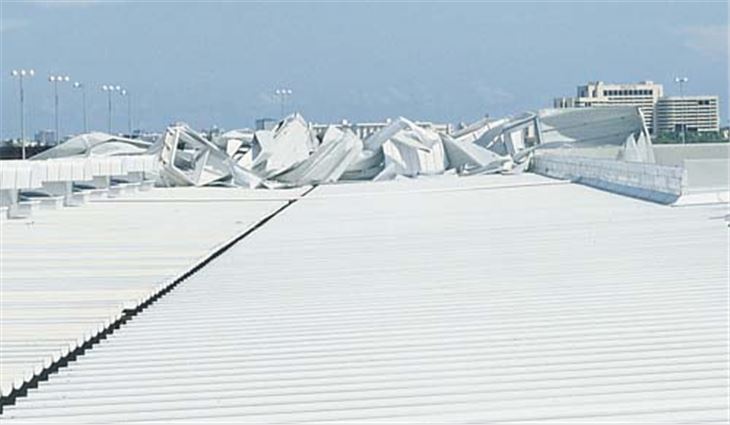 Hurricane Andrew severely damaged this structural standing-seam metal panel roof system.