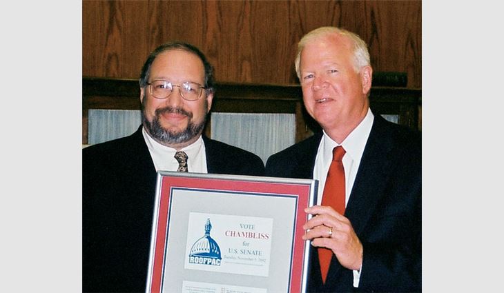 Steve Kruger, president of L.E. Schwartz & Son Inc., Macon, Ga., thanks Sen. Saxby Chambliss (R-Ga.) during NRCA's Legislators Appreciation Reception.