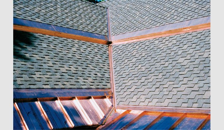 Flat and standing-seam copper panels, as well as trim and beam caps accentuate the shake asphalt shingle roof system.