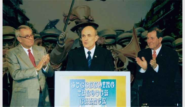 Former New York City Mayor Rudy Giuliani (center) discussed a potential war with Iraq and the Sept. 11, 2001, events during the Opening Luncheon. NRCA President Don McCrory (left), president of Kiker Corp., Mobile, Ala., and NRCA Immediate Past President Mike Promen, president of Clark Roofing Co., Broadview, Ill., applauded Giuliani's remarks.