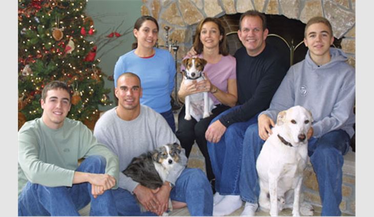 Taylor, chief executive officer and chairman of the board for Cedar Rapids, Iowa-based D.C. Taylor Co., with his wife, Julie; daughter, Lauren; sons (from left to right), Ben, Brent and Tyler; and dogs (from left to right), Stella, Riley and Buddy.
