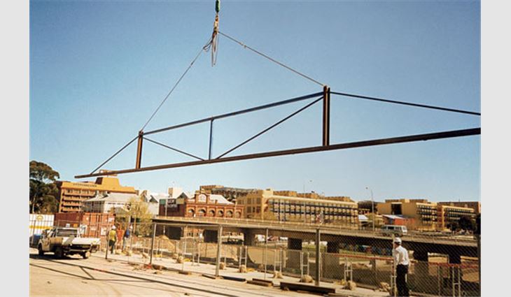 Spreader bars were used to hoist 100-foot- (30-m-) long roof panels.