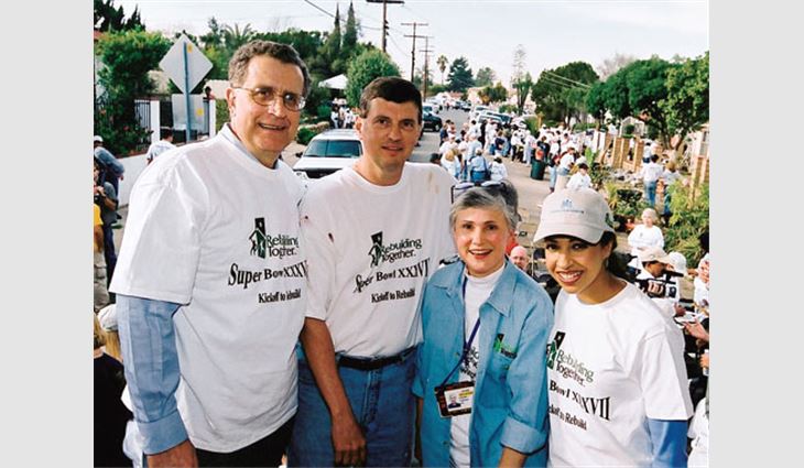 (From left to right) NFL Commissioner Paul Tagliabue, NRCA Executive Vice President Bill Good, Chandler Tagliabue and 2003 Miss America Erika Harold assisted more than 250 volunteers during Kickoff to Rebuild 2003.