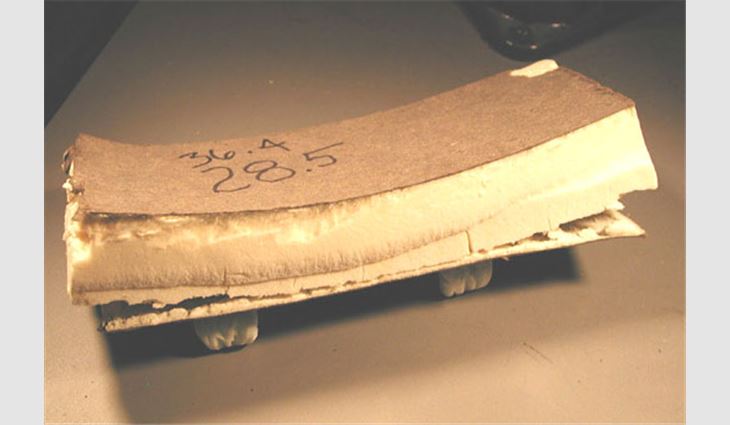 This photo shows the extent of the foam core's distortion caused by the facer&#151;the board absorbed 28 percent of its dry weight in water.