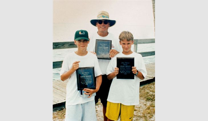 Gustafson, president and owner of Gustafson Industries Inc., Boynton Beach, Fla., with his sons Michael (left) and Ryan after winning first, second and third places at a Florida Roofing, Sheet Metal and Air Conditioning Contractors Association fishing tournament in Orlando, Fla.