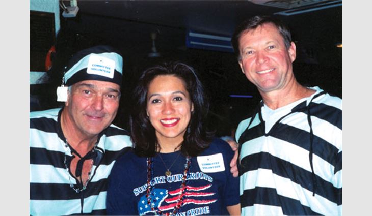 Registration workers for the Arizona Roofing Contractors Association's bowling tournament that benefited the Greater Phoenix Youth At Risk Foundation pose for a photo. From left to right: Tom Penkert, Roofing Supply of Arizona, Tempe; Monica Cohen, Capital Roofing Inc., Phoenix; and Scott Morgan, TAMKO Roofing Products Inc., Joplin, Mo.
