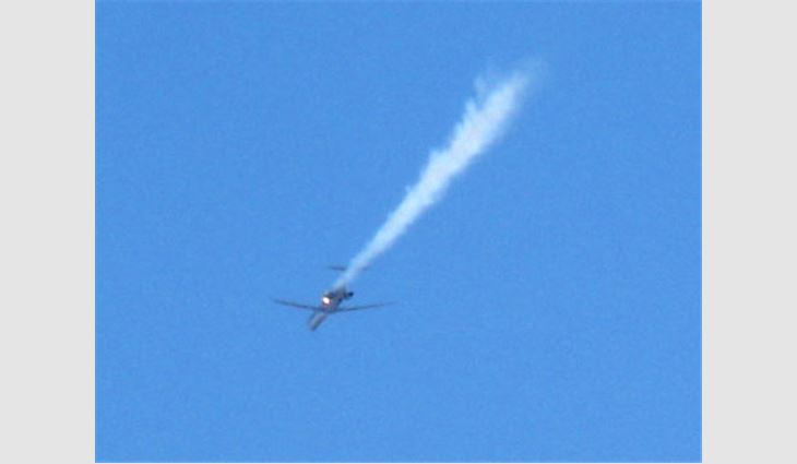 NRCA member Greg Dobbs, president and owner of Embassy Roofing Inc., Northfield, Ill., catches jet trouble on film.