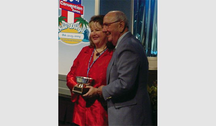 Victoria Sharples, president of Roofers Exchange, Yorba Linda, Calif., received NRCA's 2003 Charlie Raymond Award.