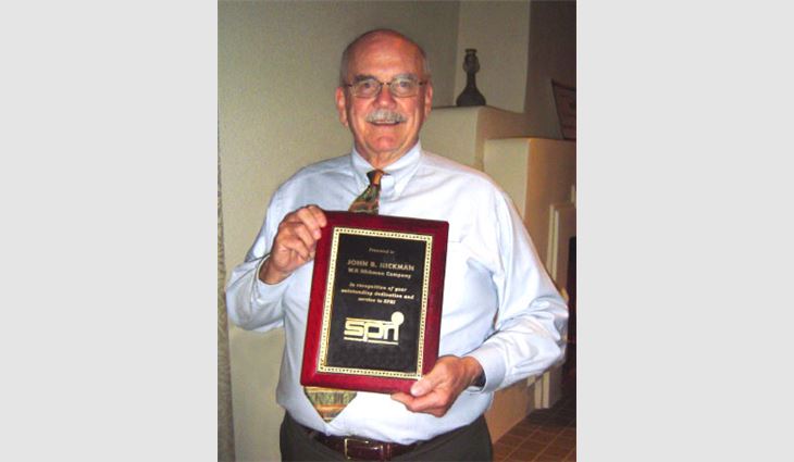 John Hickman displays his Member Appreciation Award plaque from SPRI.