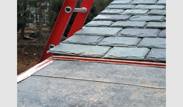 This slate eave construction includes integrating the slate roof system with a soldered flat-seam copper roof, an eave cant method that incorporates a receiver for the metal roof, underlayment system for a cold climate and low slope at the swept eave.