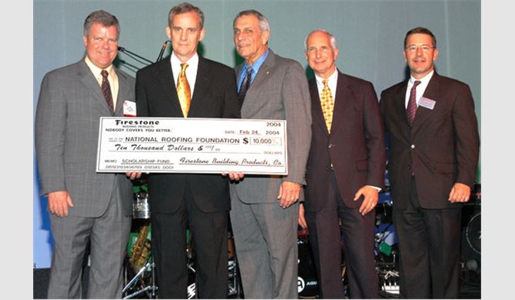 Pictured from left to right: Michael Gorey, president of Firestone Building Products; Nelson Braddy, president of the National Roofing Foundation's (NRF's) Board of Trustees; Don McCrory, NRF trustee; Chris Seidel, executive director of NRF; and Robert Delaney, vice president of sales for Firestone Building Products.