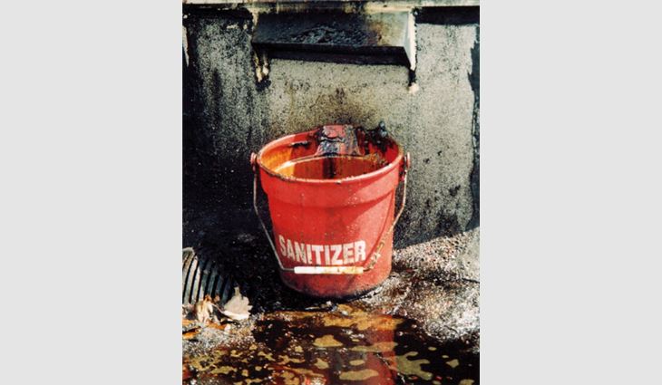 A bucket placed under a drain spout of an exhaust fan to collect contaminants does not meet industry standards. This common contraption still is being used within the food-service industry.