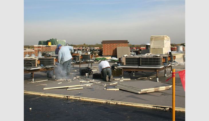 B.T. Lakeside Roofing replaces the buildings' EPDM systems with a coal-tar-pitch roof system.