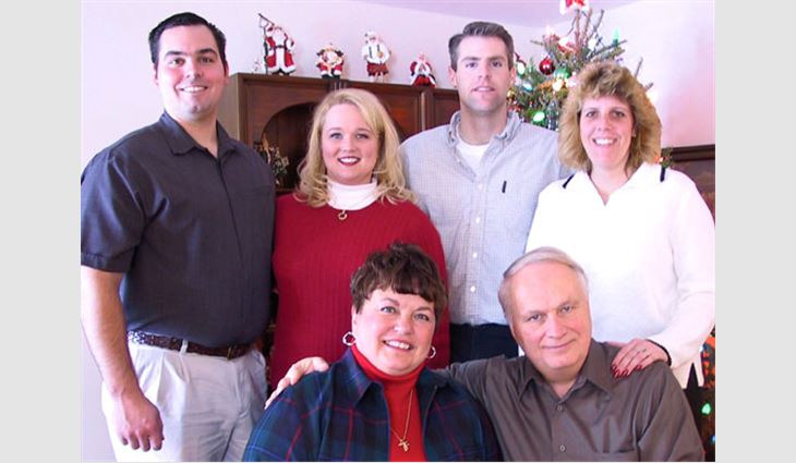 Dupuis, president and owner of Structural Research Inc., Middleton, Wis., with his family on Christmas 2001. Clockwise from bottom right: Dupuis; wife Rita; son Matt; daughter-in-law Pam; son Justin; and daughter Michelle.
