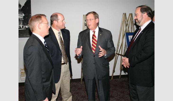 Craig Brightup, NRCA's vice president of government relations; Ribble; and Steve Kruger, president of L.E. Schwartz & Son Inc., Macon, Ga., listen to Sen. Johnny Isakson (R-Ga.).