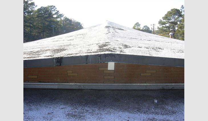 The temple's built-up roof system before the tear-off