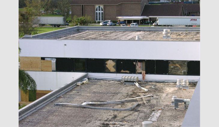 Photo 1: Aggregate from a hospital's built-up roof systems broke several windows in the intensive-care unit.
