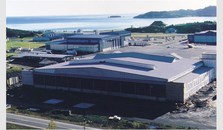 Winds of 50 mph to 100 mph are common at the Coast Guard Naval Air Station on Kodiak Island, Alaska. This facility was used to house fighter planes in the 1940s and now houses Coast Guard airplanes and helicopters. Two historic hangars with a total area of 1,480 squares are covered with a smooth-surfaced APP-modified bitumen roof membrane capped with a mineral-surfaced APP-modified bitumen cap sheet. The membranes were torch-applied.
