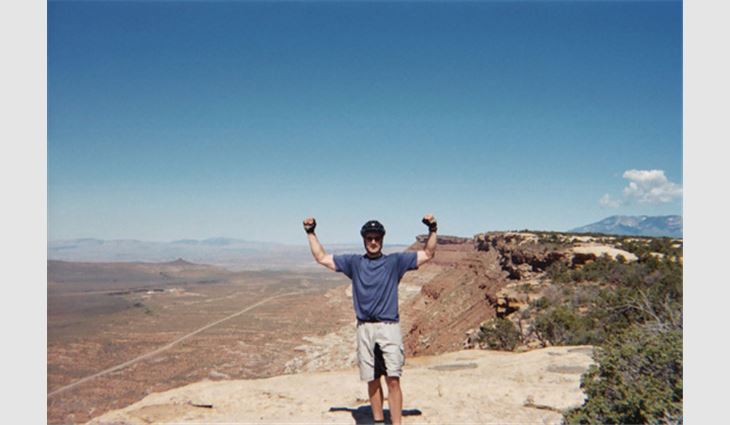 Snyder on top of a mountain he biked in St. George, Utah

