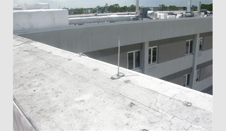 The lightning-protection system conductor on this hospital blew away, but the air terminal still was attached. If lightning were to strike this air terminal, the lightning would not safely dissipate.
