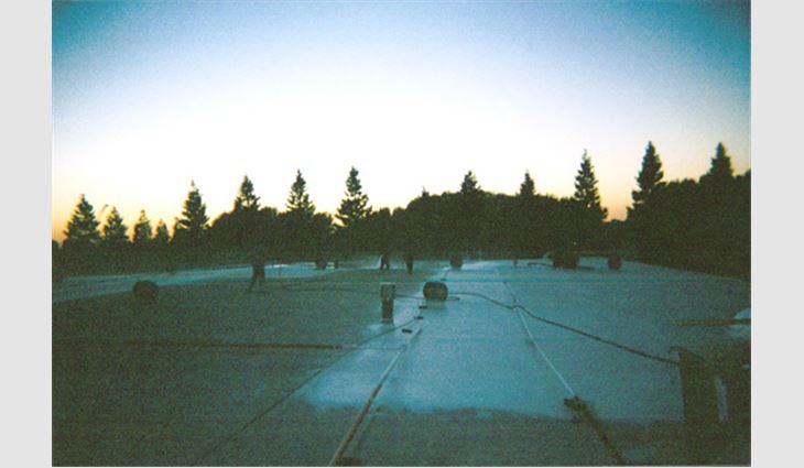 The crew of Madsen Roof Co. Inc., Sacramento, begins the "day's" work at sundown.
