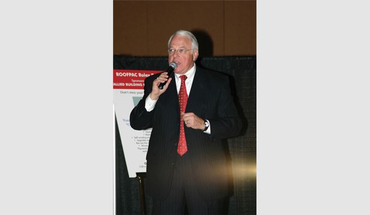 Hugh B. Miller, president of CM Benefit Auctions, acts as auctioneer during the ROOFPAC auction.
