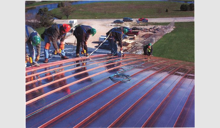 Carlson Racine Roofing & Sheet Metal Inc., Racine, Wis., installs a standing-seam copper roof system on the Johnson Athletic Center, Racine.
