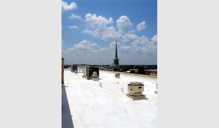 Photo of a roof system restoration after a biobased coating was installed on Baptist Medical Center's surgical wing in San Antonio