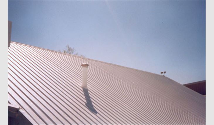 A metal roof system restoration with elastomeric acrylic coating