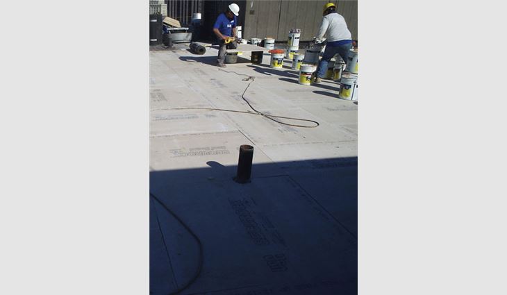 Workers install SECUROCK roof board