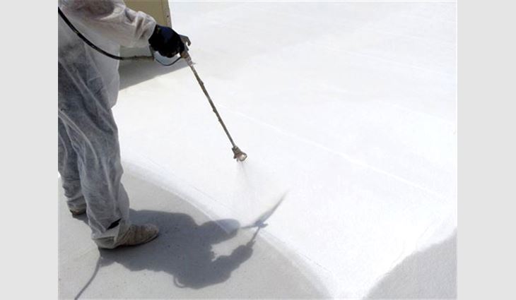 Coating is spray-applied on a roof system.