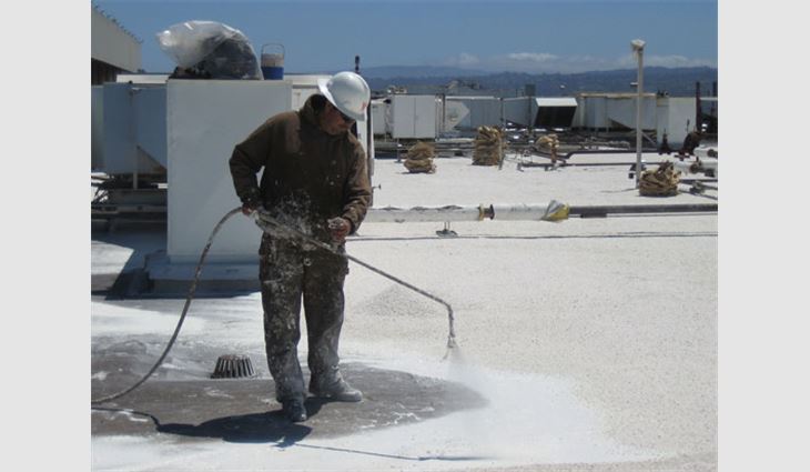 Spray application of the adhesive
