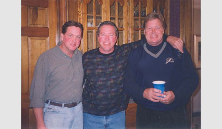 Pictured from left to right: brother John, Daly and brother Steve
