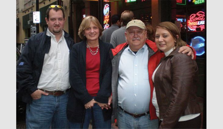 Robinson with his son Jeremiah (far left), wife Teresa (left center) and daughter Keli Ann (far right)