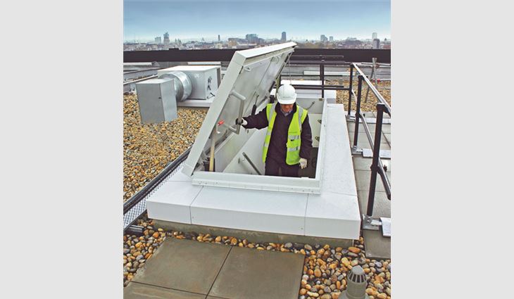 A large opening in a service stair roof hatch allows workers to easily bring tools and equipment to a rooftop.