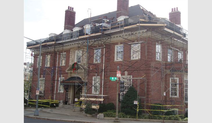The entire building had to be scaffolded with safety netting below the walkboards and on the safety railings.