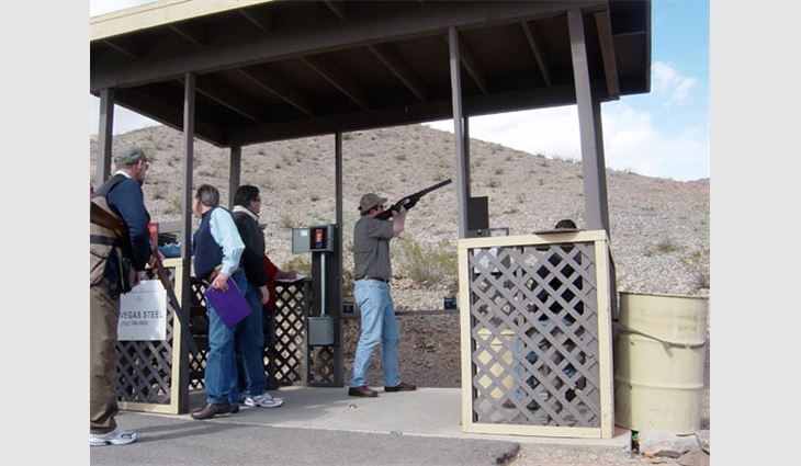 A shooter takes aim during ROOFPAC's sporting clays tournament
