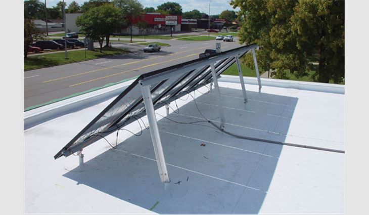 Structural solar panel supports were installed directly to the roof joists, and penetrations were flashed with Carlisle SynTec's custom-made 3/4-inch-diameter pipe seals.