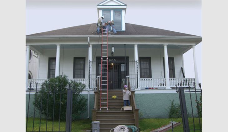 Volunteers from the Metal Construction Association reroof the rectory at St. Maurice Church in New Orleans' Lower Ninth Ward.