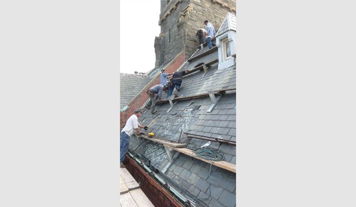 Tear-off of the existing slate roof system included temporary weatherproofing and slideguards.