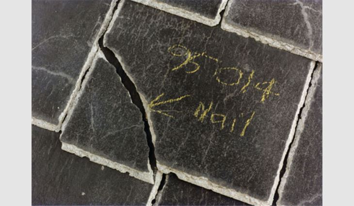 Photo 6: This crack is located over a nail in the underlying shingle.