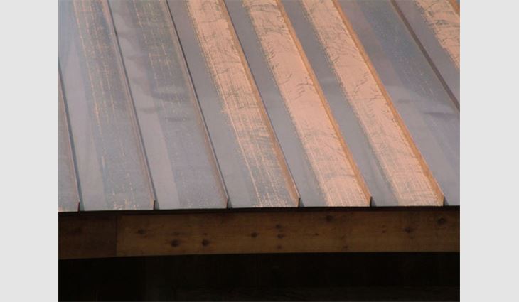 This copper roof shows uneven weathering, which is the result of a strippable film put on the copper before its installation. 