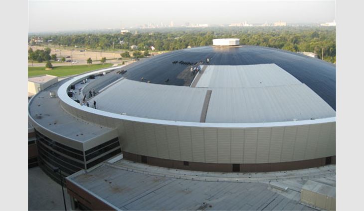 Charles Koch Arena during various stages of reroofing