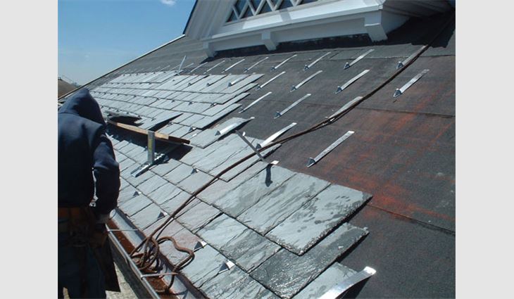 American Roofing & Metal installs 22- by 14- by 1/4-inch Buckingham-Virginia Unfading Blue-Black Slate.