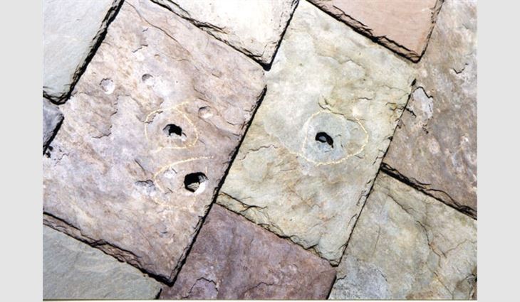 Hail-caused punctures and dents in soft slate